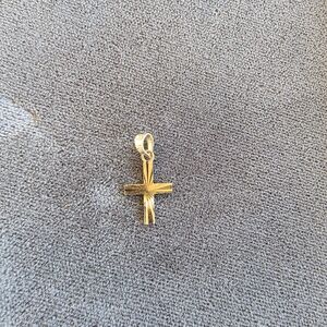 14k solid gold cross.